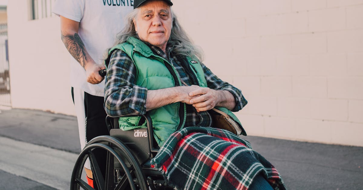 Companion care aide with senior outdoors