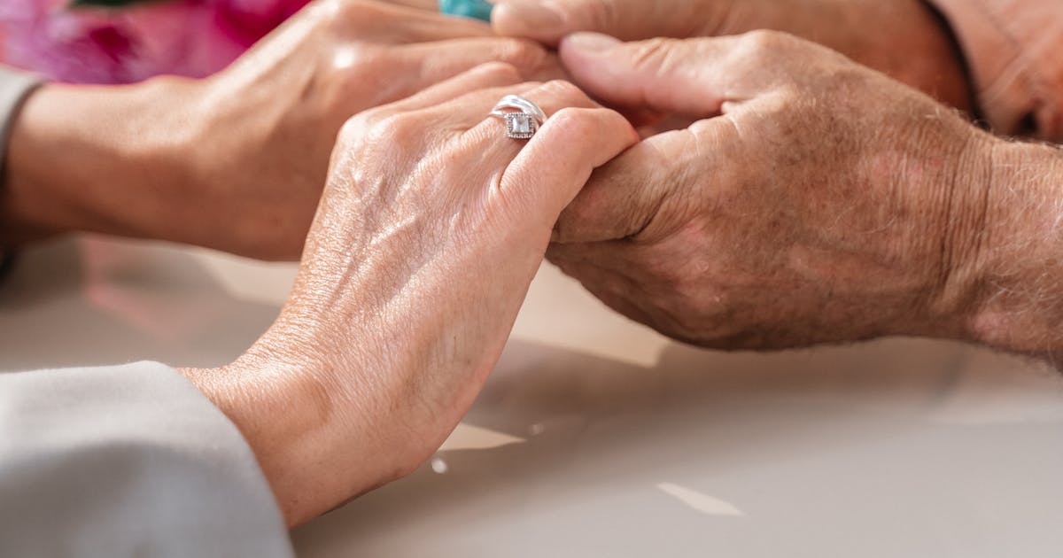 Hands held in support for Alzheimer's care
